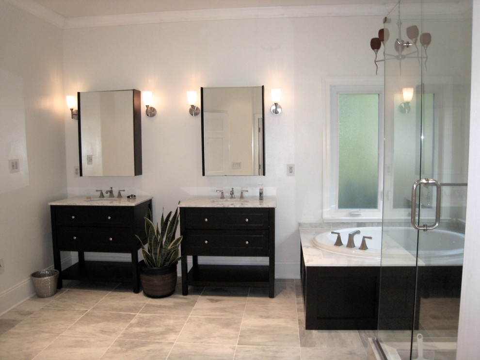 Design ideas for a large modern master bathroom in Orlando with an integrated sink, open cabinets, dark wood cabinets, marble benchtops, a drop-in tub, a corner shower, a one-piece toilet, white tile, stone tile, white walls and marble floors.
