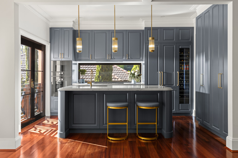 Design ideas for a transitional kitchen in Sydney with raised-panel cabinets, grey cabinets and quartz benchtops.