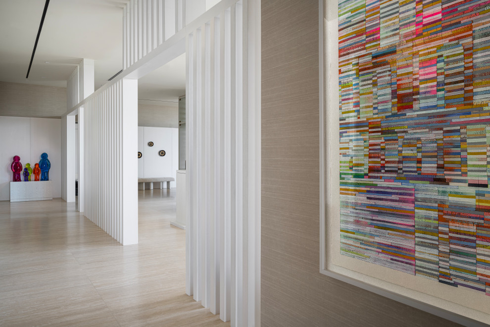 Design ideas for an expansive contemporary hallway in Miami with travertine floors.