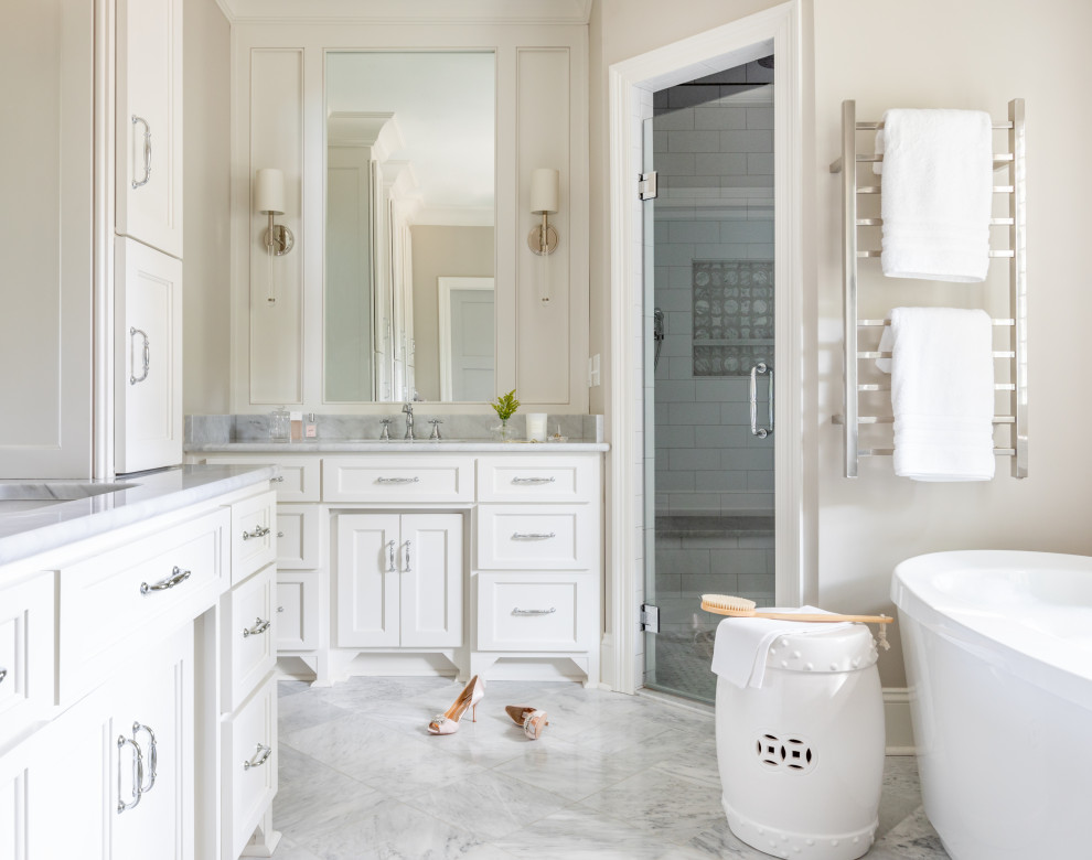 Large traditional master bathroom in Atlanta with shaker cabinets, white cabinets, a freestanding tub, beige walls, porcelain floors, an undermount sink, engineered quartz benchtops, grey floor, a hinged shower door, grey benchtops, a single vanity, a built-in vanity and a corner shower.