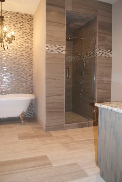 Photo of a large transitional master bathroom in Houston with furniture-like cabinets, distressed cabinets, a claw-foot tub, a two-piece toilet, gray tile, grey walls, marble floors, a corner shower, stone tile, a vessel sink and granite benchtops.