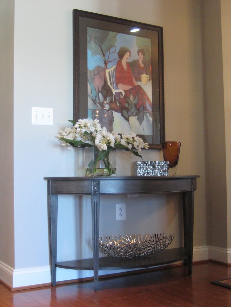 Transitional medium tone wood floor foyer photo in DC Metro with gray walls