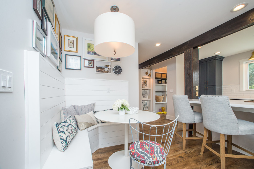 Beach style medium tone wood floor eat-in kitchen photo with shaker cabinets, gray cabinets, white backsplash and white countertops