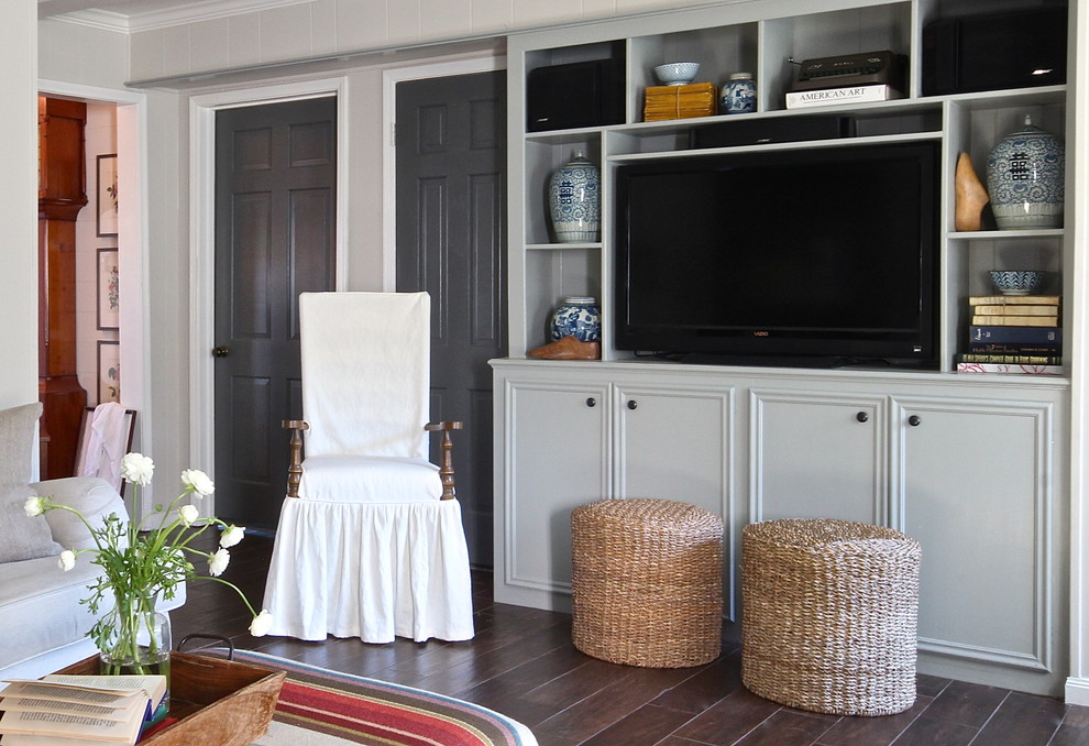 Photo of a traditional open concept family room in Houston with grey walls.