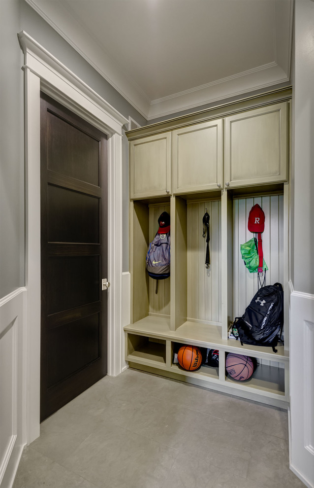 Mudroom - mid-sized transitional concrete floor and gray floor mudroom idea in Chicago with gray walls and a dark wood front door