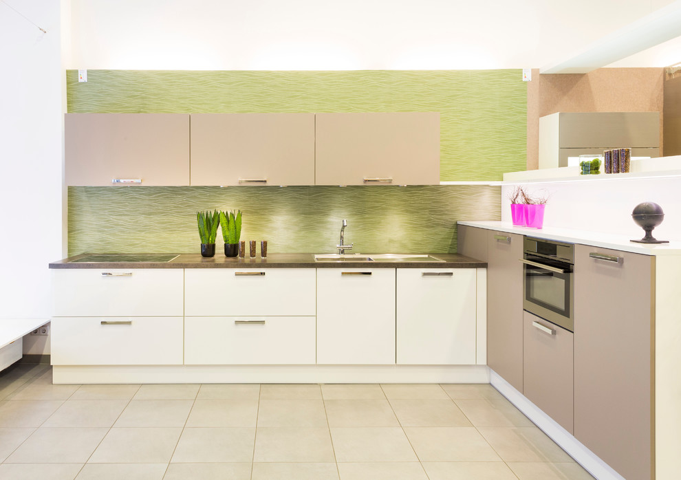 Inspiration for a medium sized contemporary l-shaped open plan kitchen in Other with white cabinets, multi-coloured splashback and glass sheet splashback.