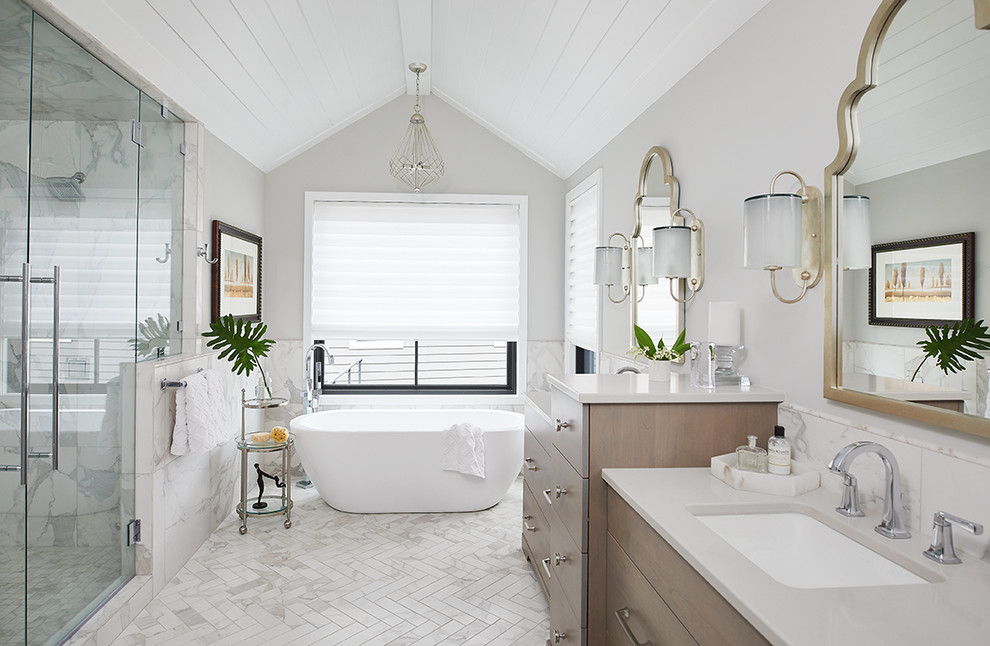 Design ideas for a transitional master bathroom in Grand Rapids with flat-panel cabinets, dark wood cabinets, a freestanding tub, grey walls, an undermount sink, white floor, grey benchtops, multi-coloured tile, ceramic floors, a hinged shower door, a double vanity, a freestanding vanity, timber and a double shower.