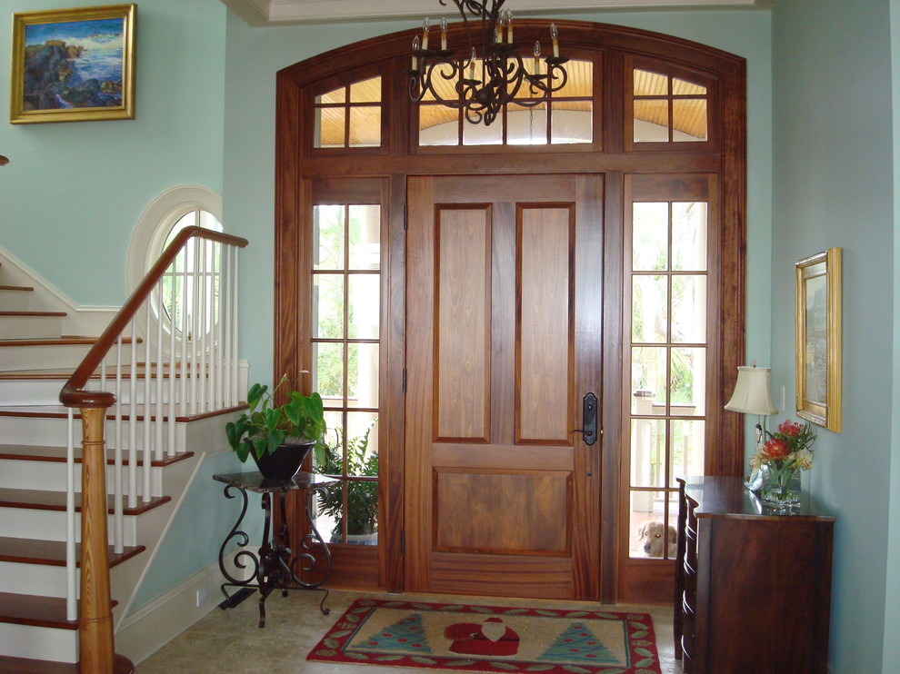 Design ideas for a mid-sized transitional front door in Charleston with blue walls, porcelain floors, a single front door and a medium wood front door.