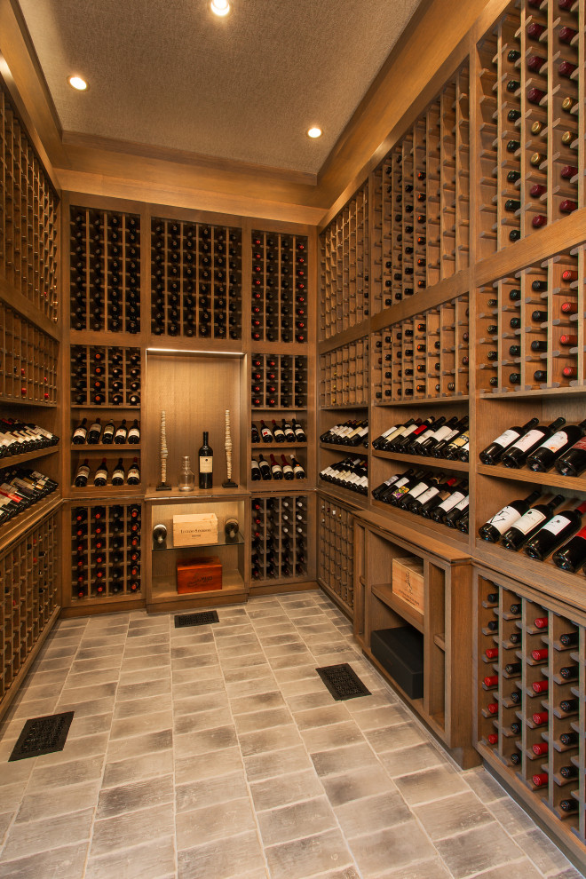 Design ideas for a mediterranean wine cellar in Dallas with storage racks and multi-coloured floor.