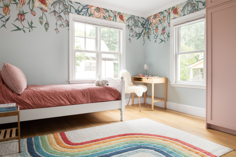 Inspiration for a transitional girl light wood floor and wallpaper kids' bedroom remodel in Boston with blue walls