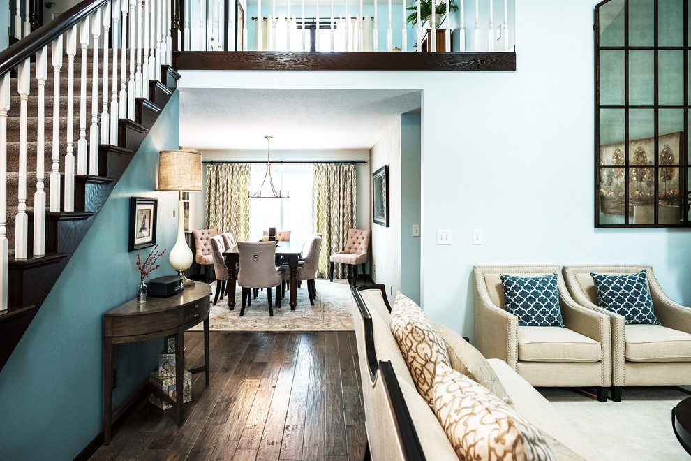 Inspiration for a mid-sized transitional dark wood floor foyer remodel with blue walls and a white front door