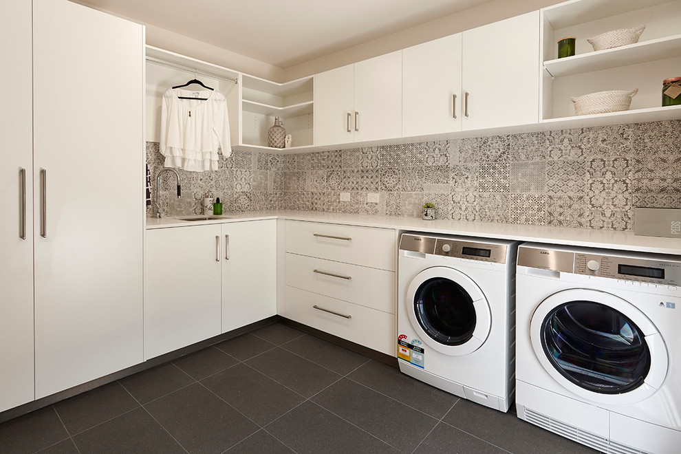 Example of a mid-sized trendy laundry room design in Hobart
