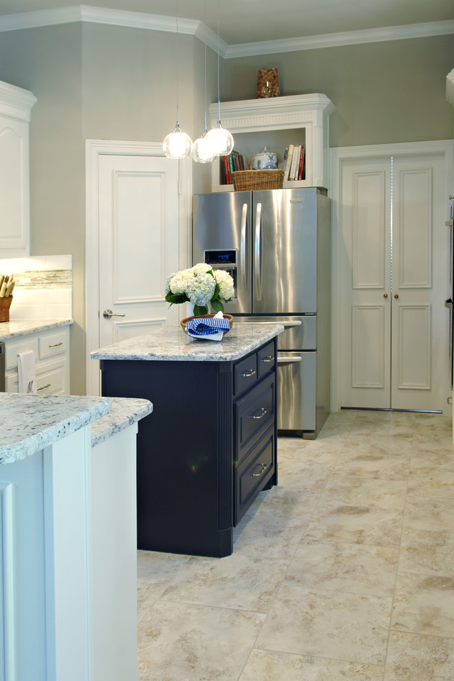 Example of a large transitional u-shaped eat-in kitchen design in Dallas with white cabinets, granite countertops, multicolored backsplash, matchstick tile backsplash, stainless steel appliances and an island