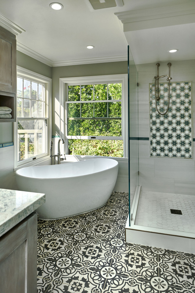 Photo of a large transitional master bathroom in San Francisco with shaker cabinets, grey cabinets, a freestanding tub, an open shower, a two-piece toilet, white tile, porcelain tile, grey walls, cement tiles, an undermount sink, engineered quartz benchtops, grey floor, an open shower, green benchtops, a double vanity and a built-in vanity.