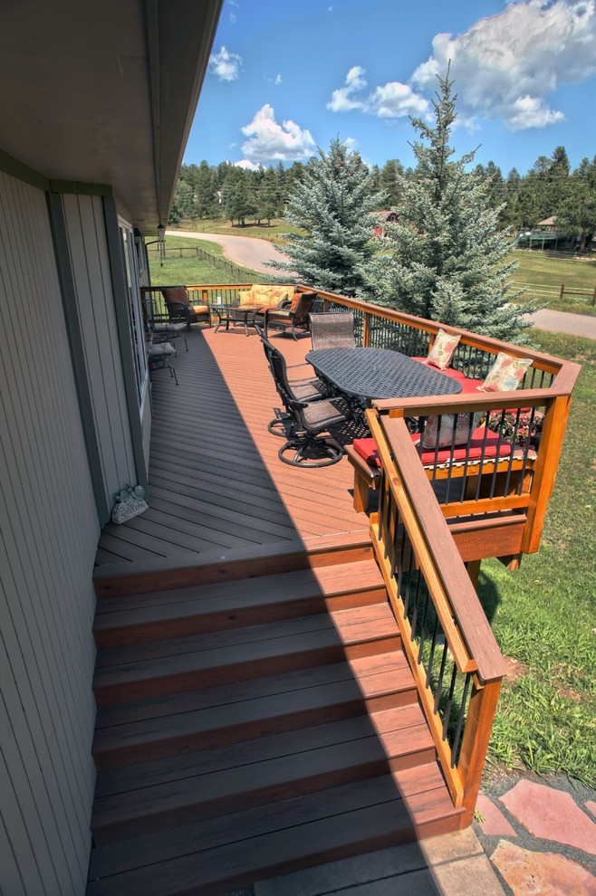 Photo of a large arts and crafts backyard deck in Denver with no cover.