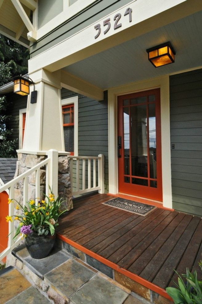 Large arts and crafts two-storey grey house exterior in San Francisco with wood siding.