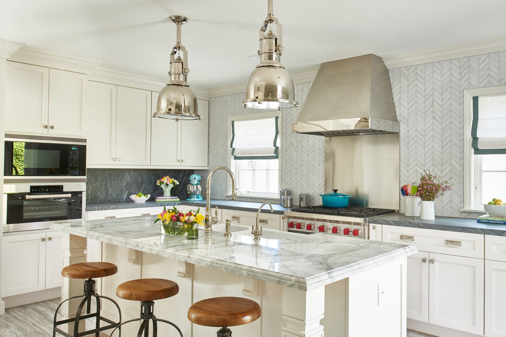 Large transitional separate kitchen in Los Angeles with a farmhouse sink, shaker cabinets, white cabinets, quartzite benchtops, mosaic tile splashback, porcelain floors and with island.