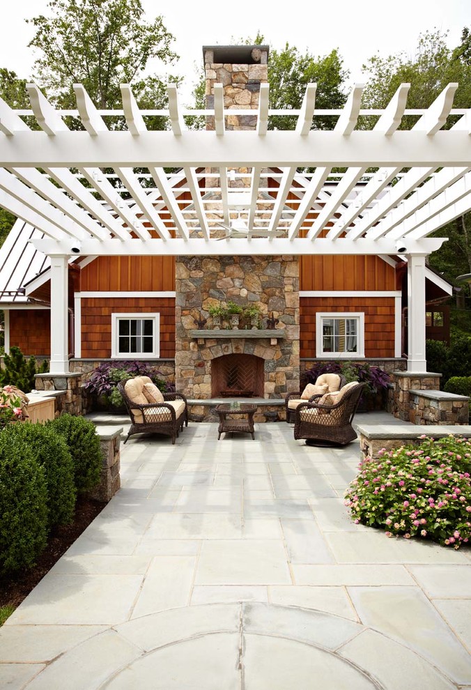 Traditional patio in New York with an outdoor kitchen and a pergola.