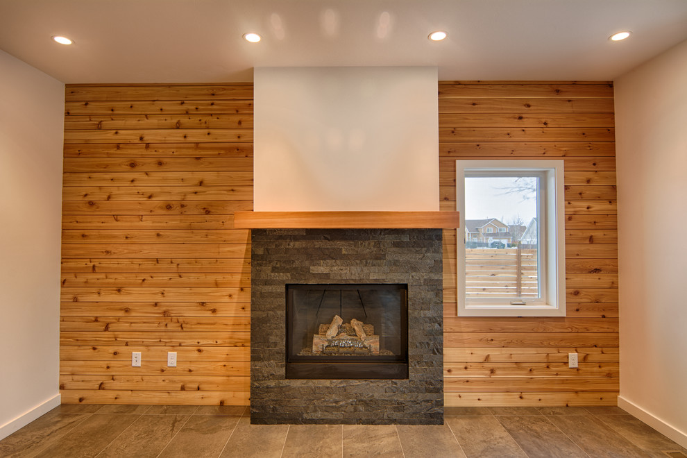 This is an example of a mid-sized contemporary open concept living room in Other with white walls, porcelain floors, a standard fireplace, a stone fireplace surround and no tv.