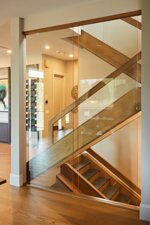 Design ideas for a modern slate u-shaped staircase with wood risers and mixed railing.
