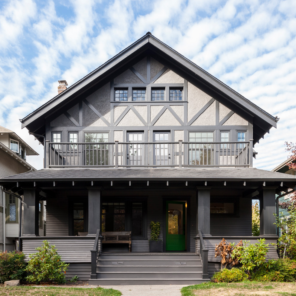 Mid-sized transitional two-storey brown house exterior in Seattle with mixed siding, a gable roof and a shingle roof.