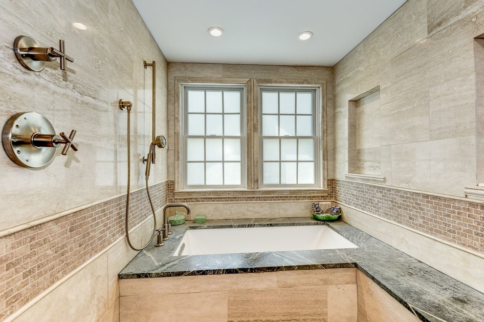 Mid-sized contemporary master wet room bathroom in DC Metro with an undermount tub, multi-coloured tile, marble, travertine floors, soapstone benchtops, a hinged shower door and green benchtops.