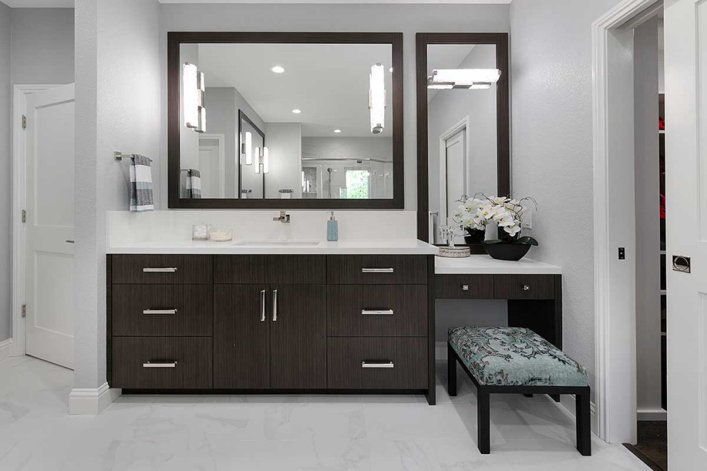 Large traditional ensuite bathroom in San Francisco with flat-panel cabinets, dark wood cabinets, a two-piece toilet, white tiles, porcelain tiles, grey walls, porcelain flooring, engineered stone worktops, white floors, a hinged door, white worktops, an enclosed toilet, double sinks, a built in vanity unit, an alcove shower and a submerged sink.