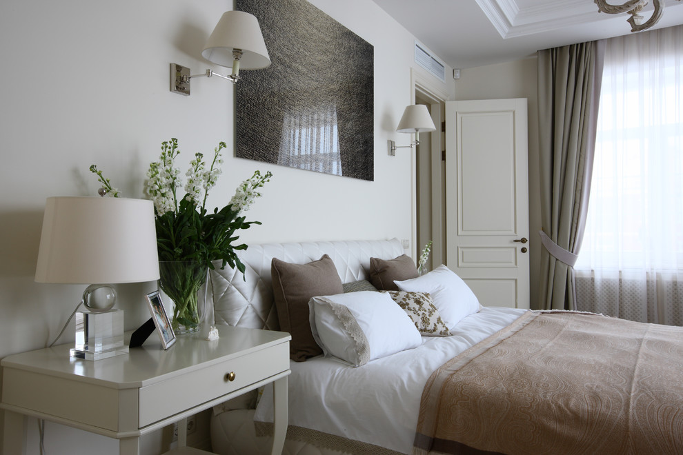 Photo of a large transitional master bedroom in Moscow with white walls.