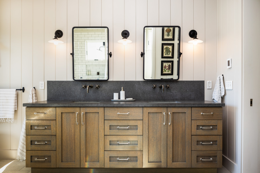 Inspiration for a large farmhouse ensuite bathroom in San Francisco with dark wood cabinets, a freestanding bath, a corner shower, white tiles, metro tiles, limestone worktops, a hinged door, grey worktops, double sinks and a freestanding vanity unit.