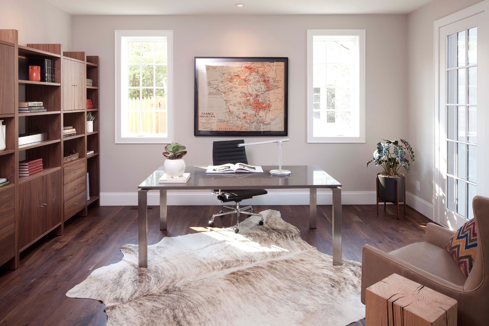 Contemporary home office in Minneapolis with grey walls, dark hardwood floors and a freestanding desk.