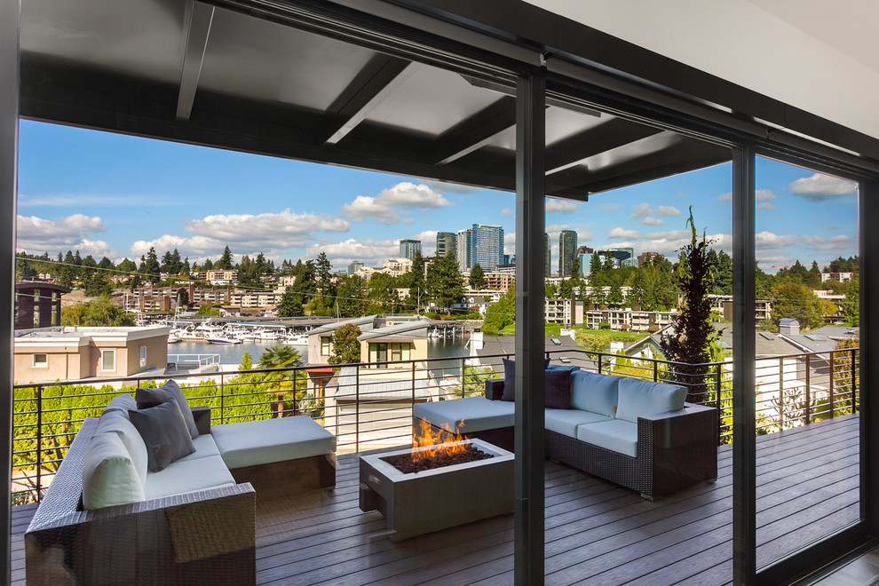 Design ideas for a large contemporary deck in Seattle with an awning.