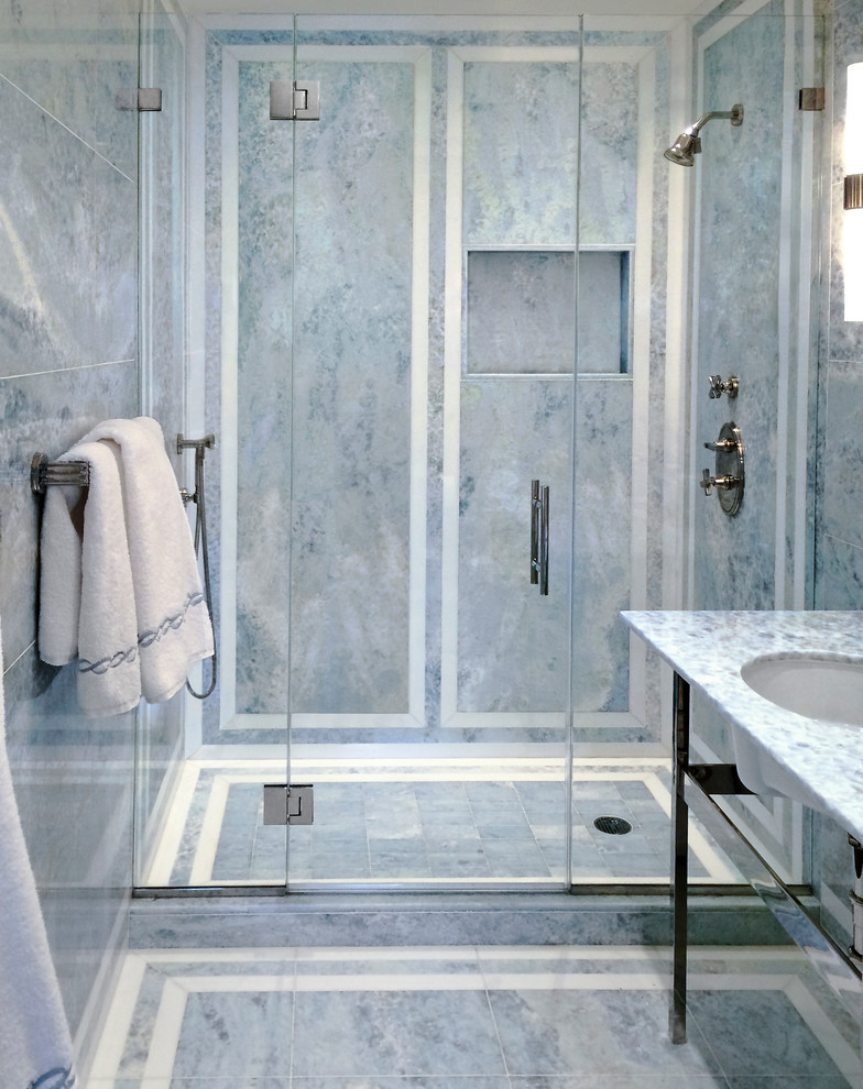 Design ideas for a mid-sized transitional bathroom in New York with a curbless shower, blue tile, stone tile, blue walls, marble floors, a pedestal sink and marble benchtops.
