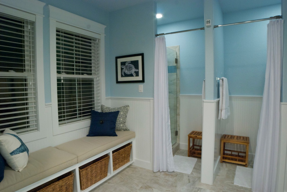 This is an example of a large beach style kids bathroom in Houston with an undermount sink, open cabinets, white cabinets, granite benchtops, a one-piece toilet, beige tile, blue walls, ceramic floors, an alcove shower and ceramic tile.