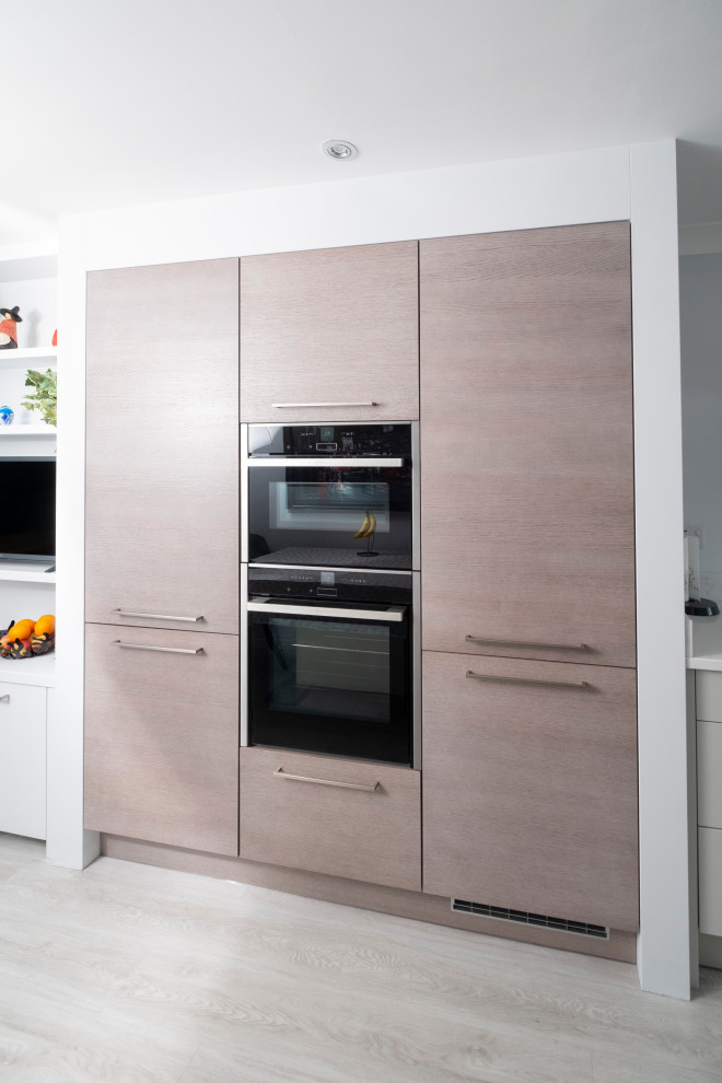 This is an example of a mid-sized contemporary kitchen in Cardiff.