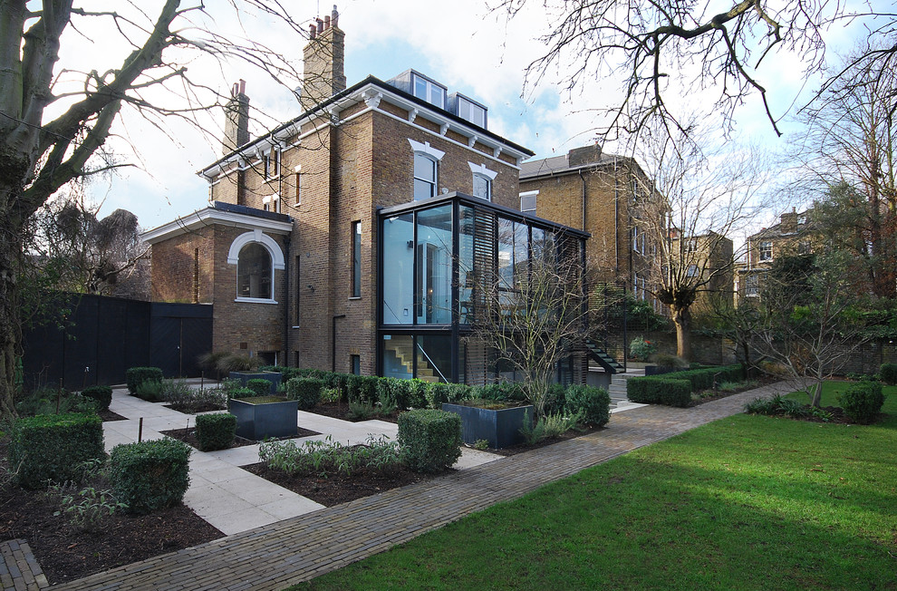 Design ideas for a large contemporary three-storey brick exterior in London.