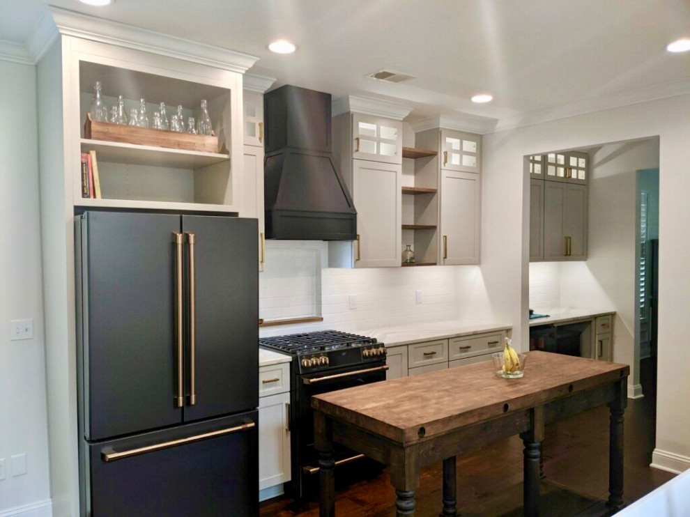 This is an example of a mid-sized transitional eat-in kitchen in Indianapolis with grey cabinets, subway tile splashback and with island.