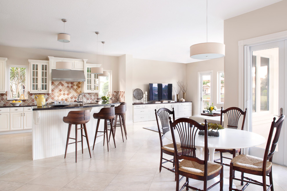 Open concept kitchen - transitional l-shaped open concept kitchen idea in Miami with raised-panel cabinets, white cabinets and brown backsplash