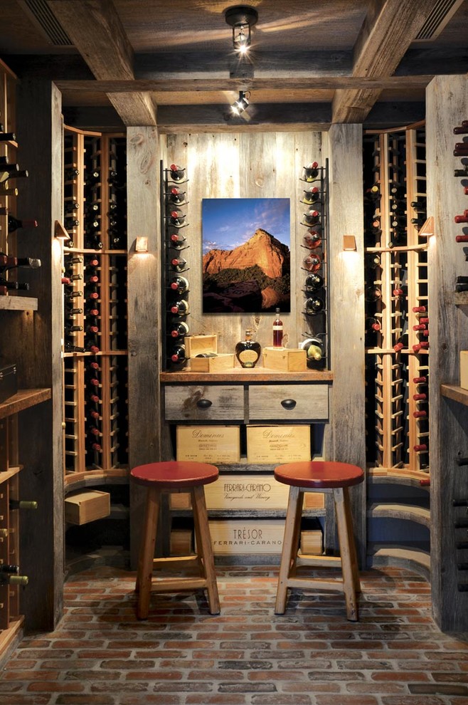 Inspiration for a country wine cellar in Orange County with brick floors and storage racks.