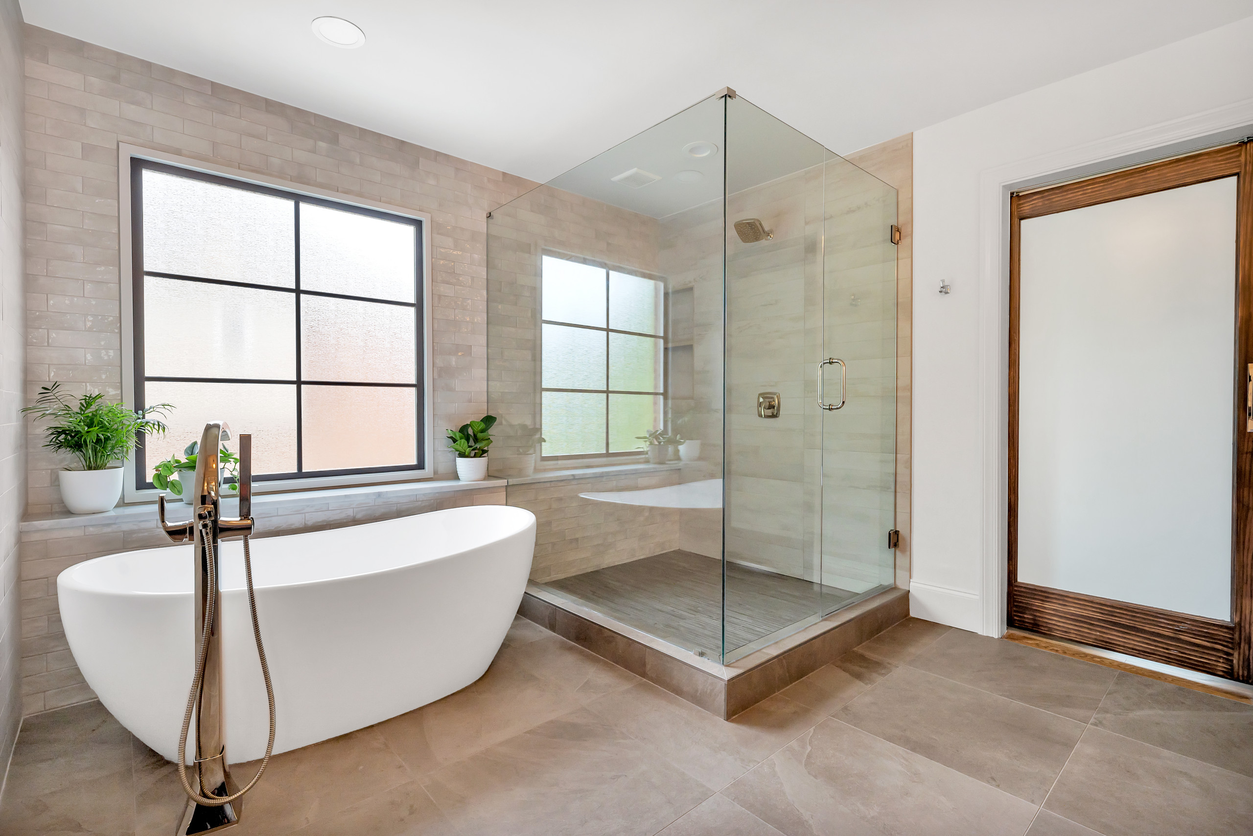 From Builder Grade From the 90’s to a Modern and Sophisticated Spa Feel