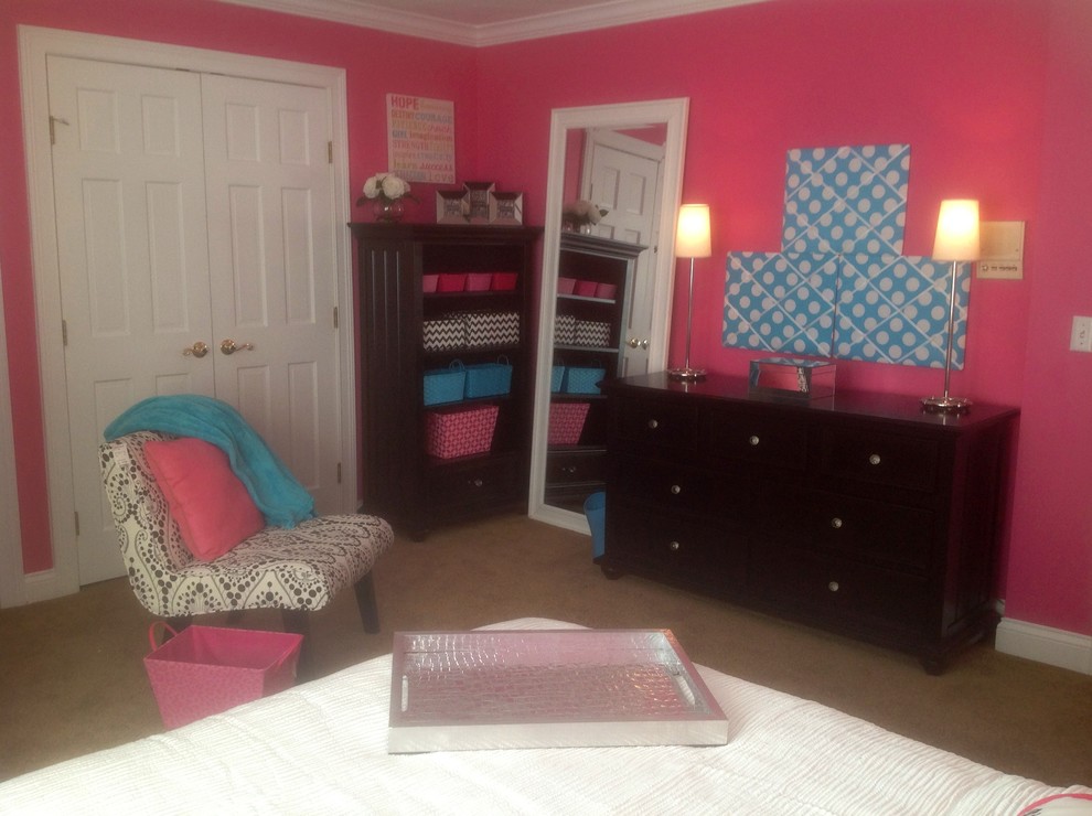 Photo of a large traditional kids' bedroom for kids 4-10 years old and girls in Cincinnati with pink walls and carpet.