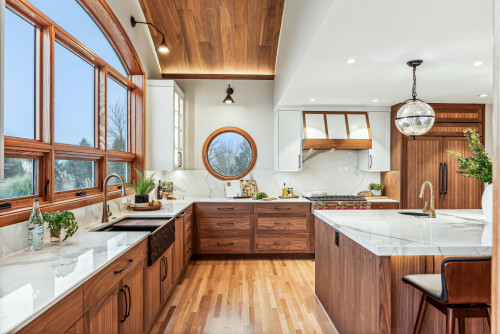 Modern kitchen with wood cabinets, marble countertops, and eco-friendly materials in cabinet design for a warm and sustainable look.