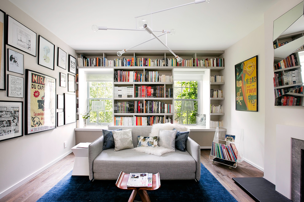 Midcentury enclosed living room in New York with beige walls and dark hardwood floors.