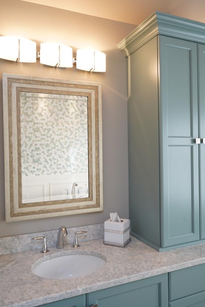 Photo of a large transitional master bathroom in Philadelphia with flat-panel cabinets, turquoise cabinets, a freestanding tub, a curbless shower, a two-piece toilet, white tile, porcelain tile, grey walls, porcelain floors, an undermount sink, engineered quartz benchtops, grey floor, a hinged shower door and grey benchtops.