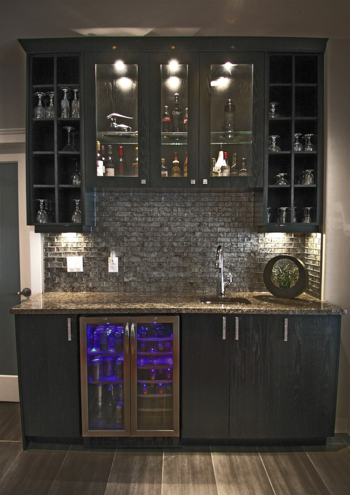Inspiration for a small contemporary single-wall wet bar in Other with an undermount sink, flat-panel cabinets, black cabinets, granite benchtops, stone tile splashback, ceramic floors and grey splashback.