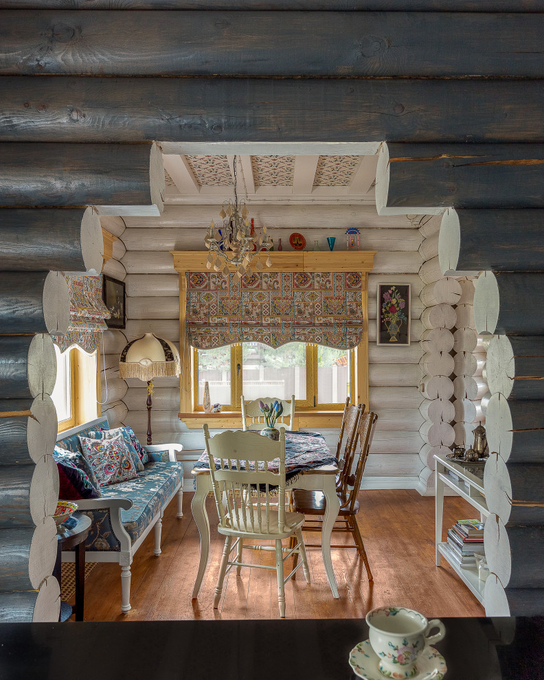 Example of a mountain style dining room design in Moscow