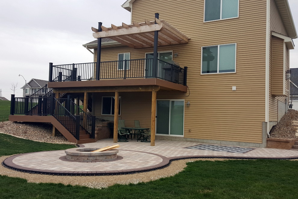Inspiration for a large backyard deck remodel with a pergola