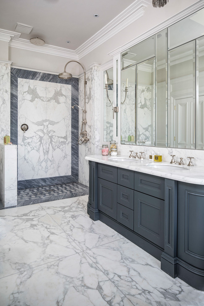 Traditional master bathroom in Florence with marble floors, an undermount sink, an open shower, white benchtops, recessed-panel cabinets, blue cabinets, an open shower, blue tile, white tile, marble, white floor and marble benchtops.