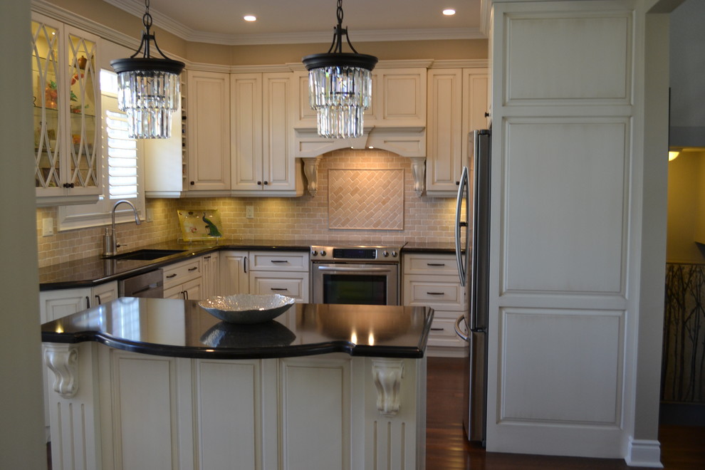Mid-sized transitional galley dark wood floor eat-in kitchen photo in Toronto with a drop-in sink, raised-panel cabinets, beige cabinets, quartz countertops, beige backsplash, stone tile backsplash, stainless steel appliances and an island