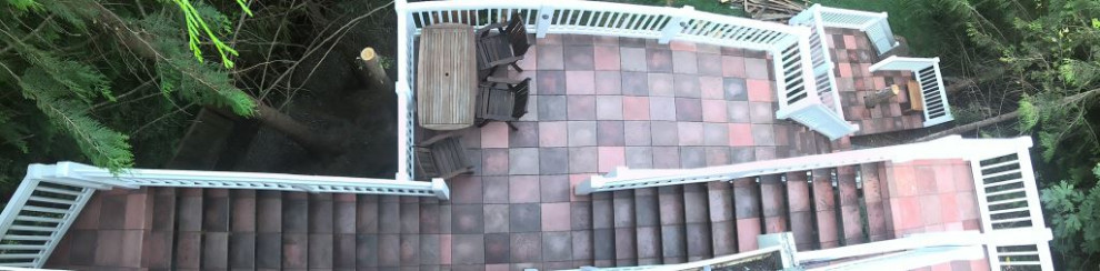 Inspiration for a large rustic backyard second story wood railing deck remodel in Seattle
