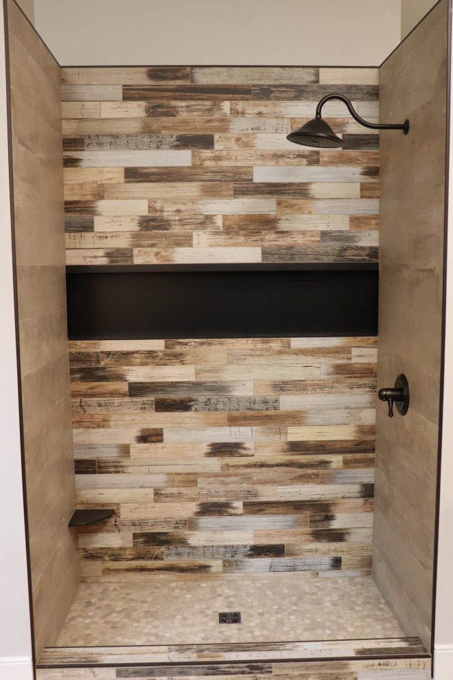 Mid-sized mountain style 3/4 multicolored tile alcove shower photo with beige walls and a hinged shower door